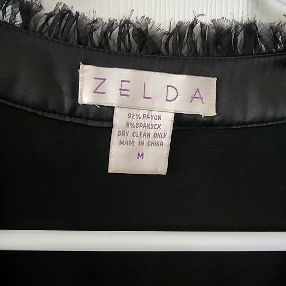 Elegant Black Sleeveless Blouse with Satin Trim - Picture 2 of 4